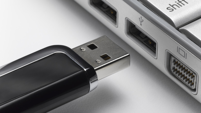 USB stick next to laptop