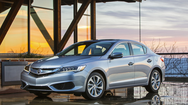 2016 Acura ILX with DCT8 in front of modern building, front-left 3/4 view
