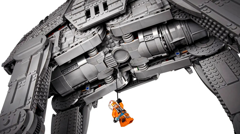 The Luke Skywalker minifigure wiching up to the AT-AT's bomb-drop hatch.
