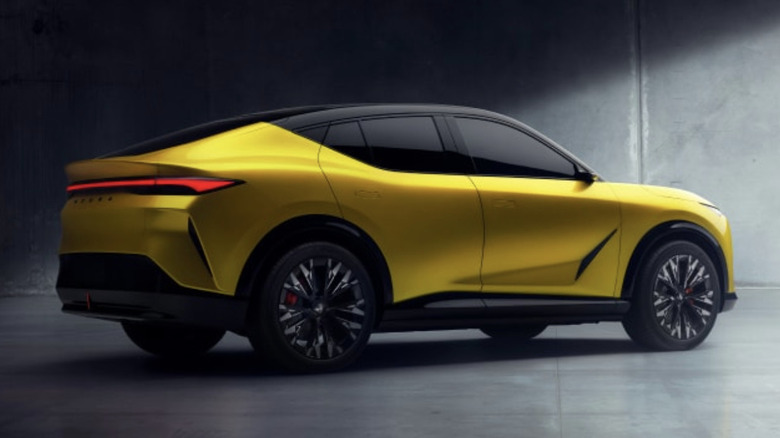 left rear view of yellow Acura RSX prototype in studio