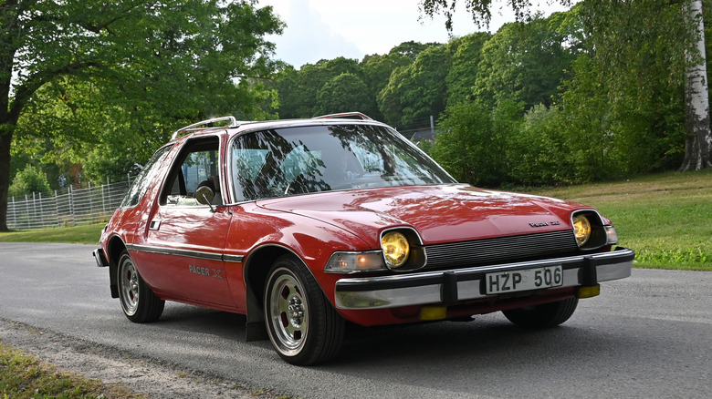 A red AMC Pacer on the road
