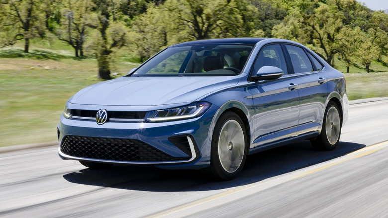 VW Jetta driving on a sunny country highway