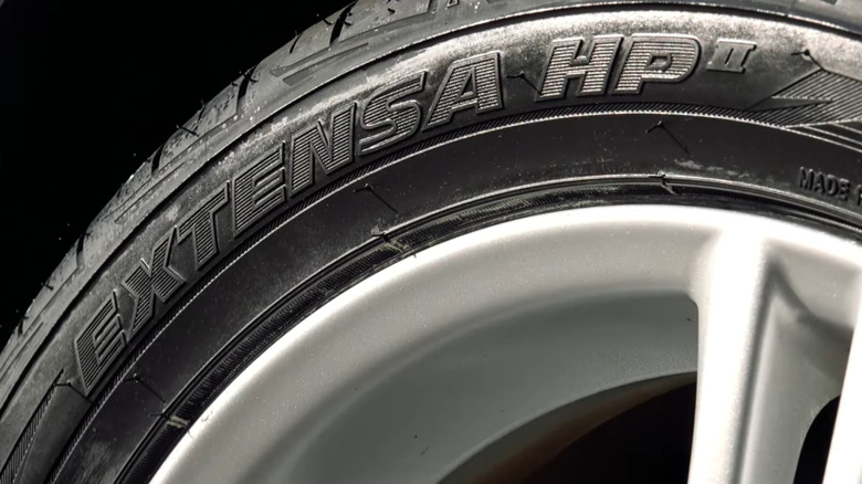 Close-up of Toyo Extensa A/S II tire on vehicle