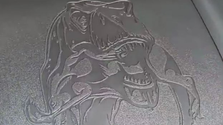 T Rex Biting a raptor Easter egg on Ram truck