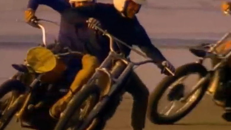 Steve McQueen riding motorcycle in On Any Sunday