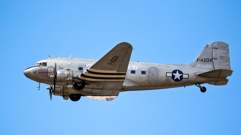 Military Douglas DC-3 in blue sky