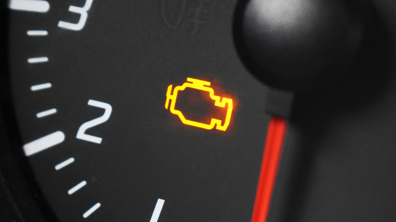 Check engine light symbol flashing on