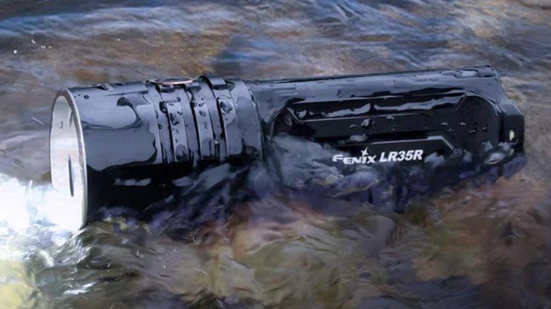 The Fenix LR35R flashlight in running water.