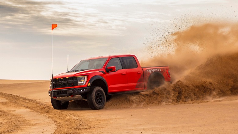 Ford F-150 Raptor R driving on sand dunes