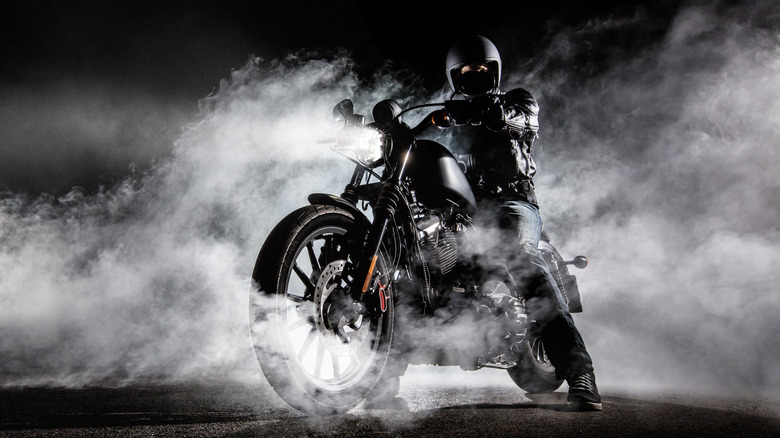 A man riding a souped-up motorcycle.