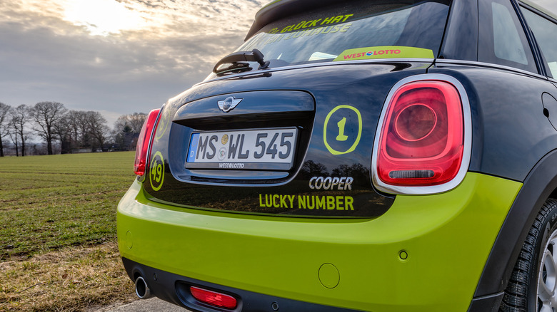 The rear end and license plate of a Mini Cooper