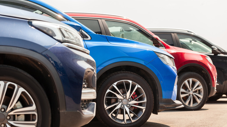 A close-up of multiple cars parked next to each other.