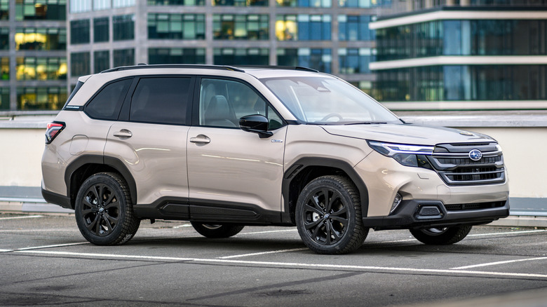 A Subaru Forester SUV parked outside.