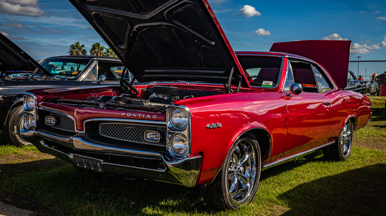 Red 1966 Pontiac Tempest parked