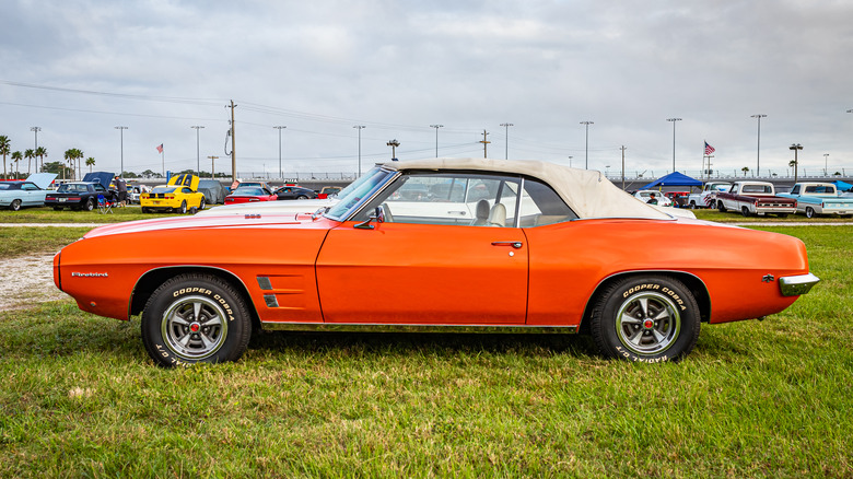 Orange Pontiac firebird convertible parked