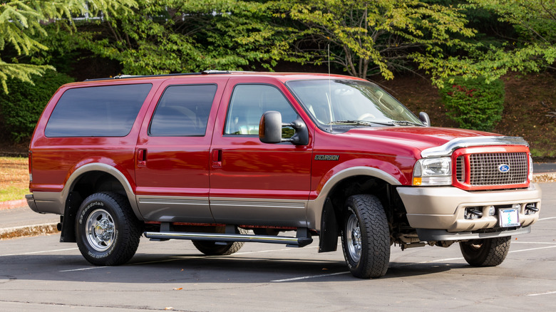 Red Ford Excursion in parking lot