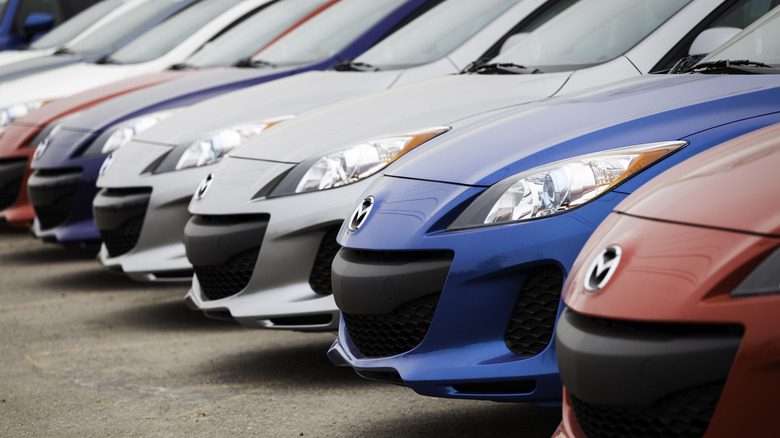 a line of parked Mazdas