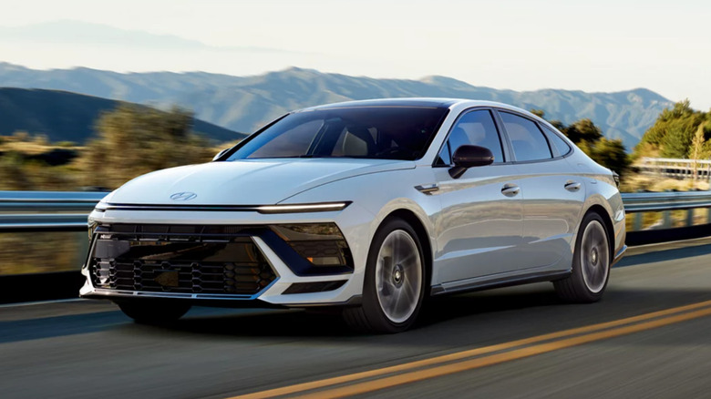 Hyundai Sonata driving down road
