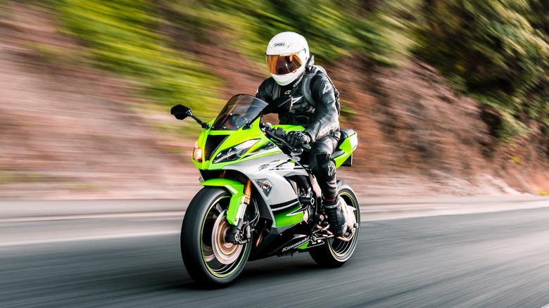 Man riding kawazaki motorcycle