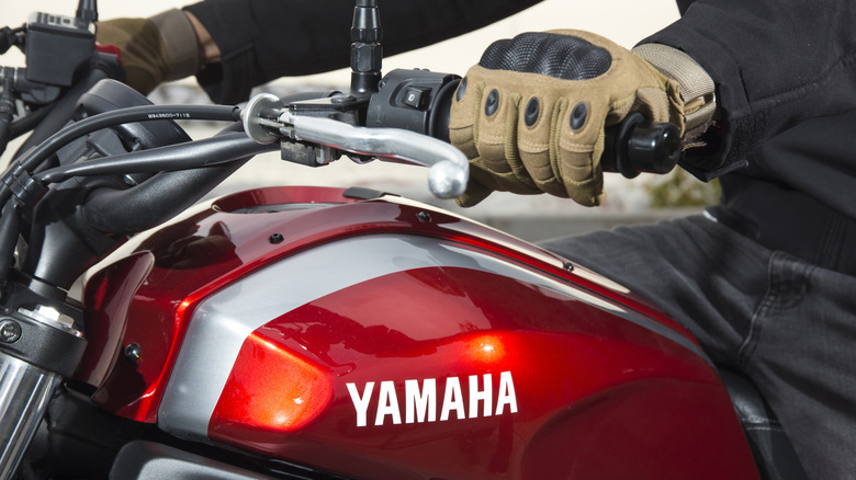 Man riding a Yamaha XSR700 with logo zoomed in