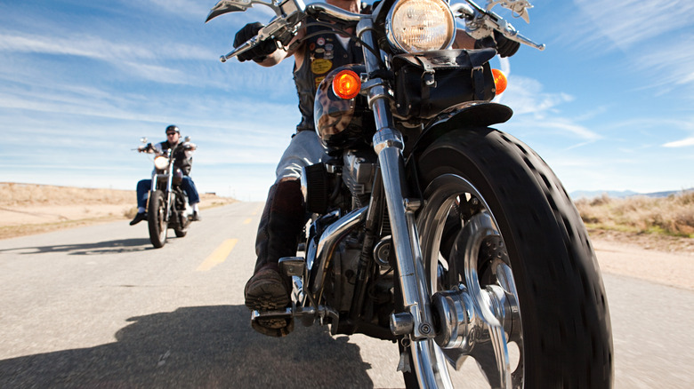 two motorcycle riders on the road