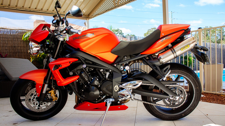 orange Speed Triple R parked