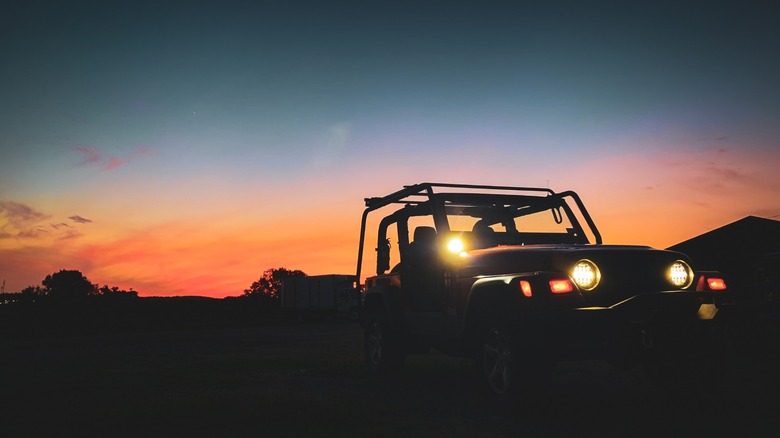 Jeep Wrangler with accessories at sunset