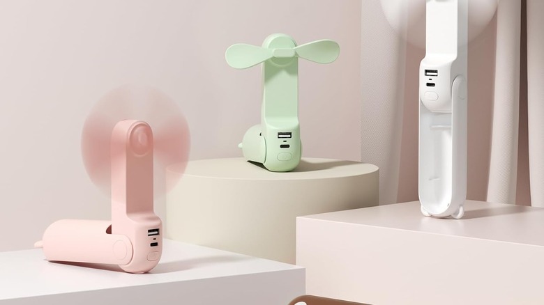 Jisulife mini fans on table