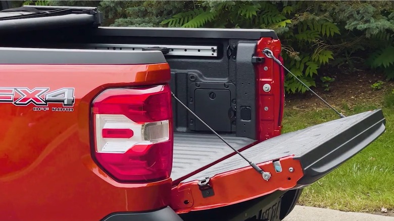 Red 2022 Ford Maverick pickup truck Multi-Position Tailgate open to the halfway setting