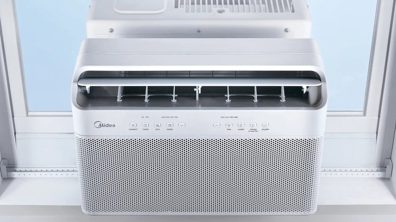 A Midea air conditioner in a window.
