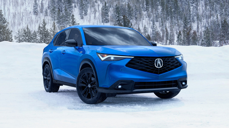 blue 2026 Acura ADX A-Spec parked in the snow in the mountains