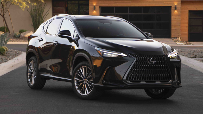 black 2026 Lexus NX parked in front of a home