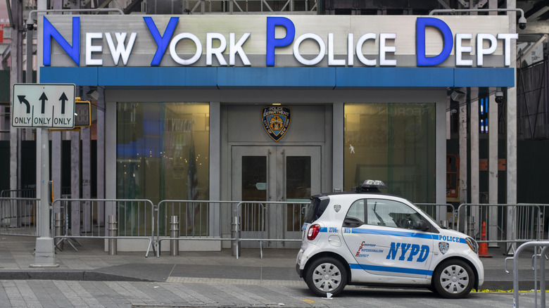 A tiny, bean-shaped NYPD Smart ForTwo patrol car is seen parked outside the NYPD Times Square substation in Midtown Manhattan, New York City.