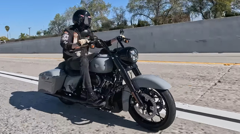 Rider cruising on the highway on a 2024 Harley-Davidson Road King Special