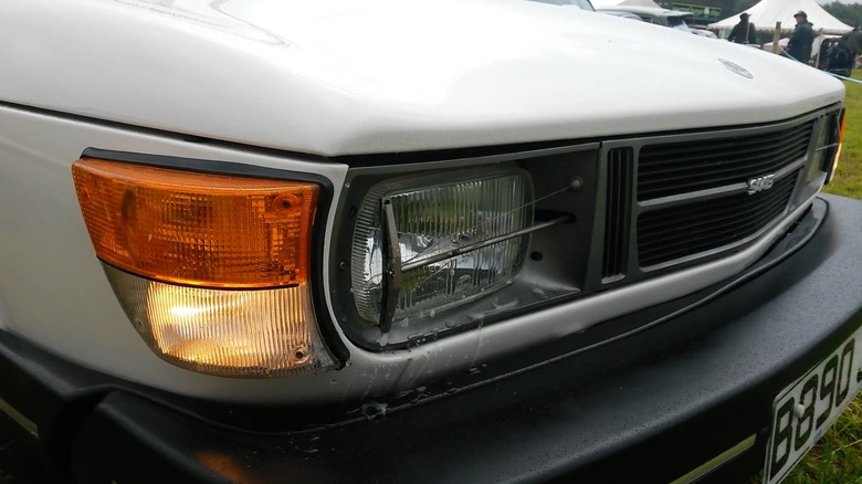 A white Saab 99 with headlight wiper system