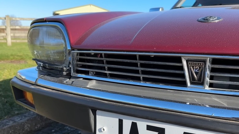 A Jaguar XJ-S with its headlight wiper system