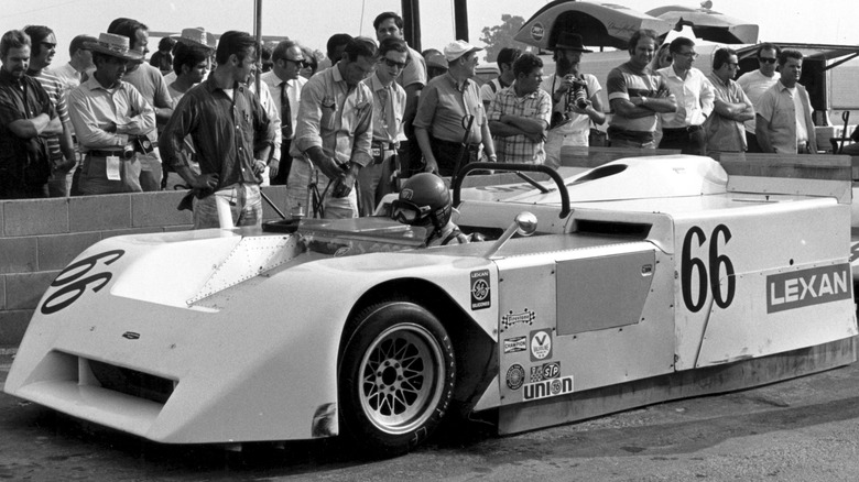 Black and white photo of Chaparral 2J in pit lane, front-left 3/4 view