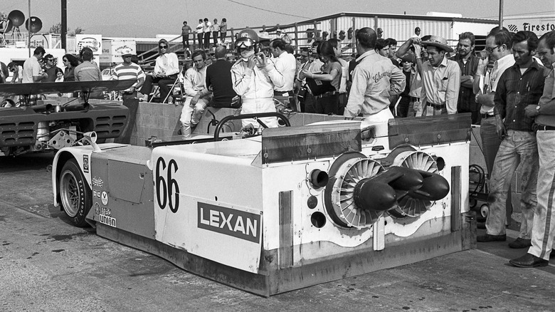 Black & White photo of 1970 Chaparral 2J in pit lane, rear-left view