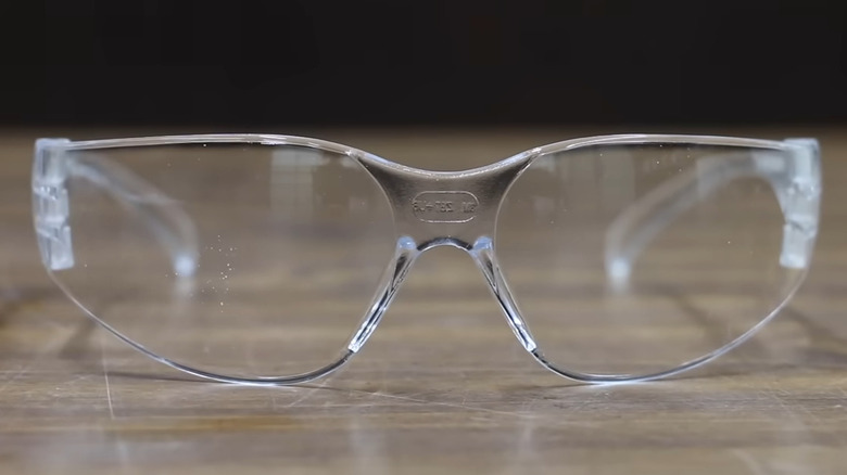 Safety glasses on a wooden table