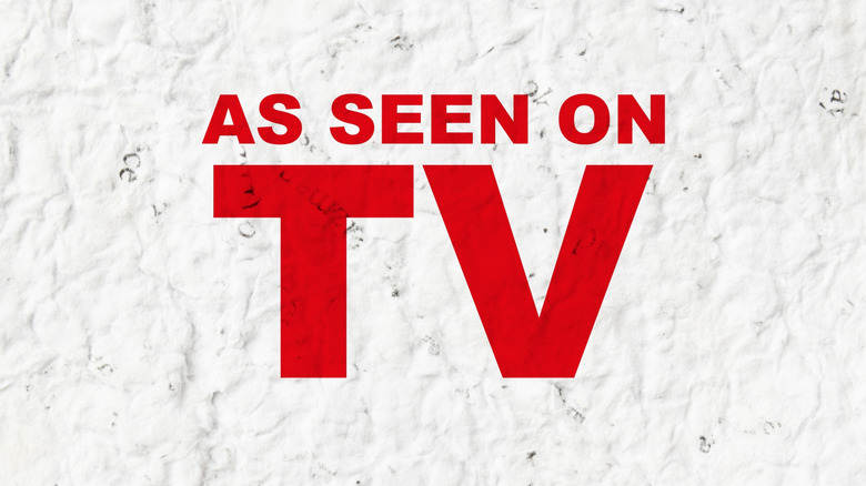 Red As Seen on TV text on textured white background