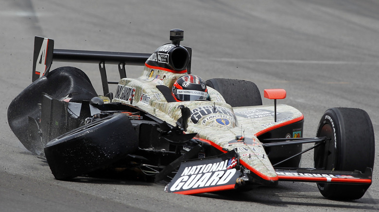 Close-up photo JR Hildebrand driving his wrecked IndyCar to a stop, front-view