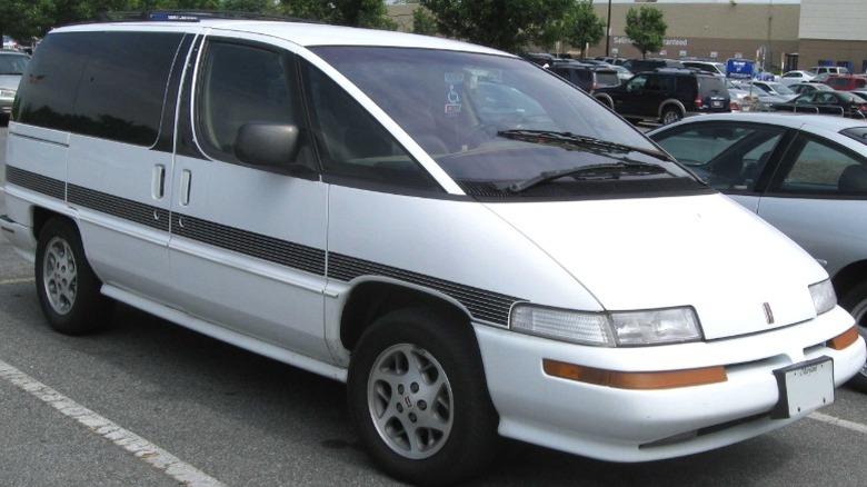 White Oldsmobile Silhouette in a parking lot