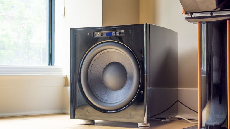 A large subwoofer in the corner of a room
