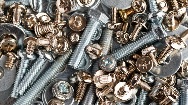 A large number of nails, tools, and bolts