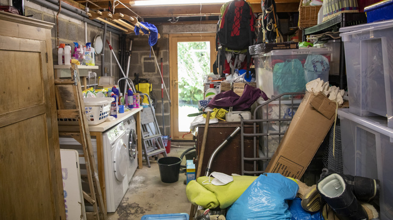 A damp outhouse full of stored household items