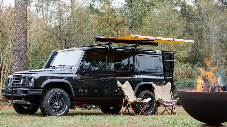 car at campsite with awning