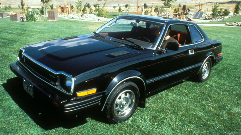 Black 1979 Honda Prelude parked on grass