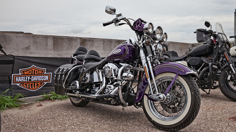 A Harley-Davidson Heritage Springer parked outside on an overcast day as part of a rally