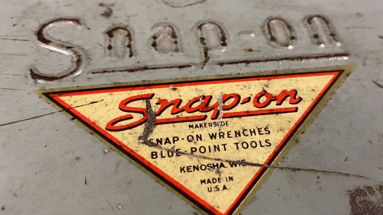 The Snap-on logo on an antique tool box.