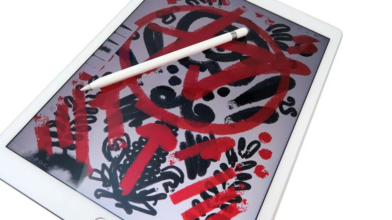 ipad pro with apple pencil on white background